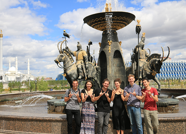 A photo of students in the Russian Flagship program. They are standing in front of the Saka Warriors Fountain located in Astana, Kazakhstan.