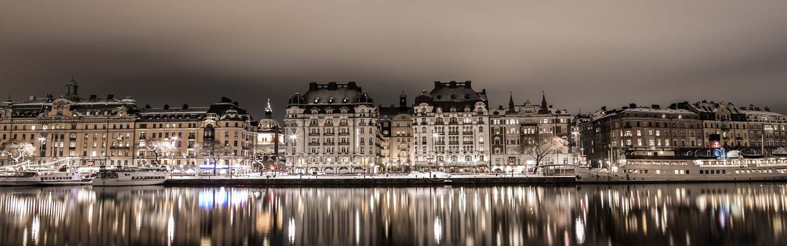 A photo of a Swedish city on the water. 