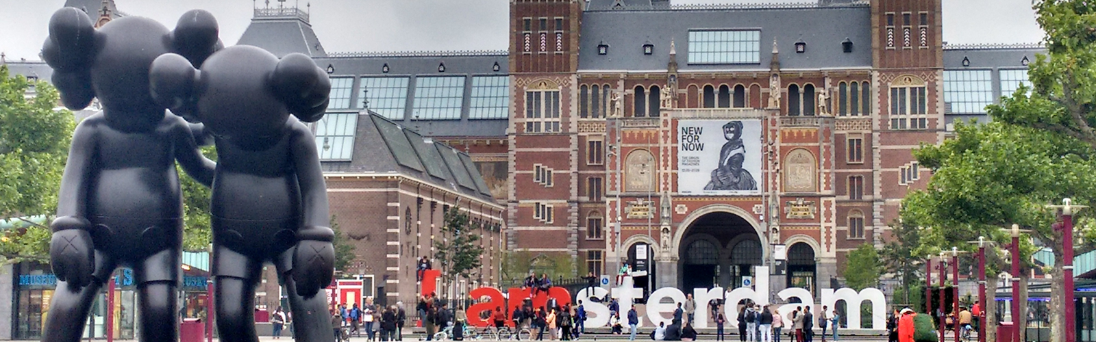 This image showcases the Rijksmuseum in Amsterdam, the national museum of the Netherlands dedicated to Dutch arts and history.