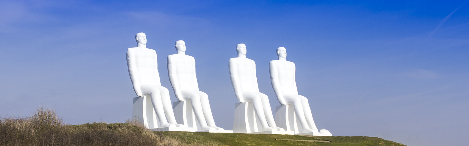 A photo of a monument called "Men at Sea"
