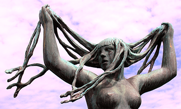 A statue of a woman with long hair.