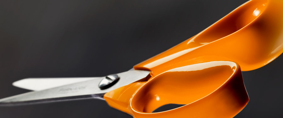 A close-up photo of scissors. The focus is on the handle.