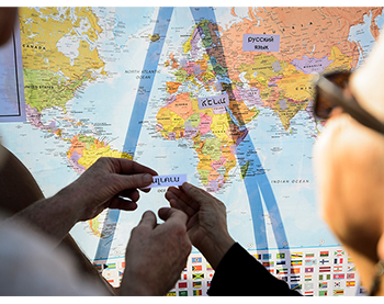 Picture for International Division. Students name countries on a map. 