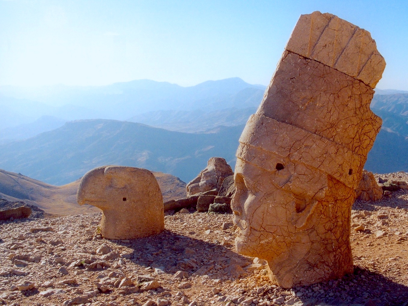 Stone statues overlook a valley in Turkey.