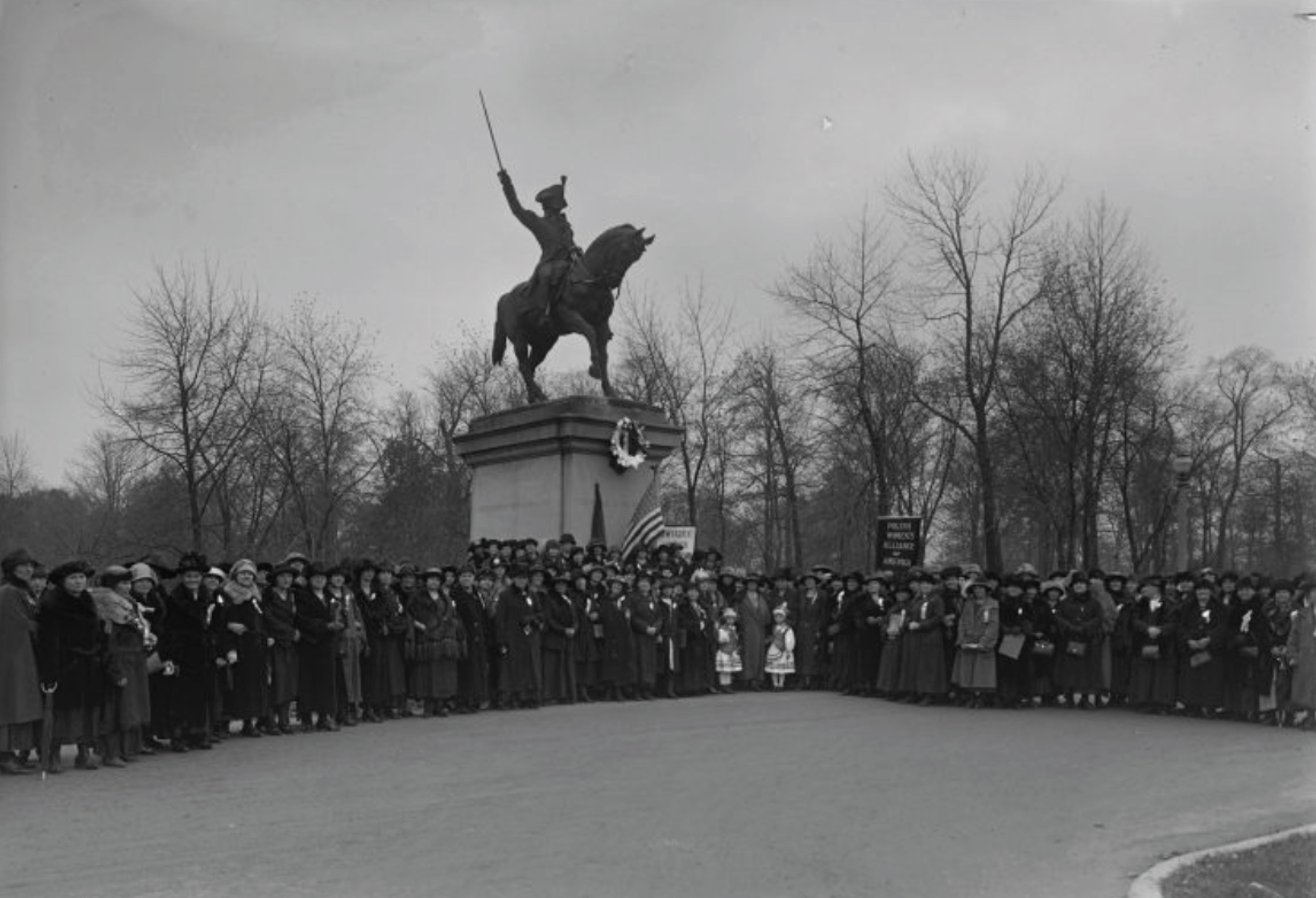 a photo of a gathering of the Polish Women's Alliance of America in front of the Kosciuszko Monument located in Milwaukee, Wisconsin