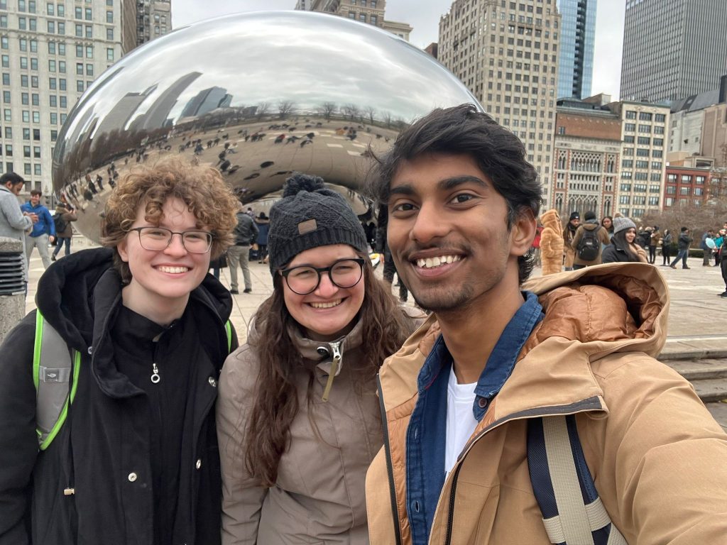 A photo featuring residents of Stockwerk Deutsch posing in front of the Cloud Gate sculpture in Chicago.
