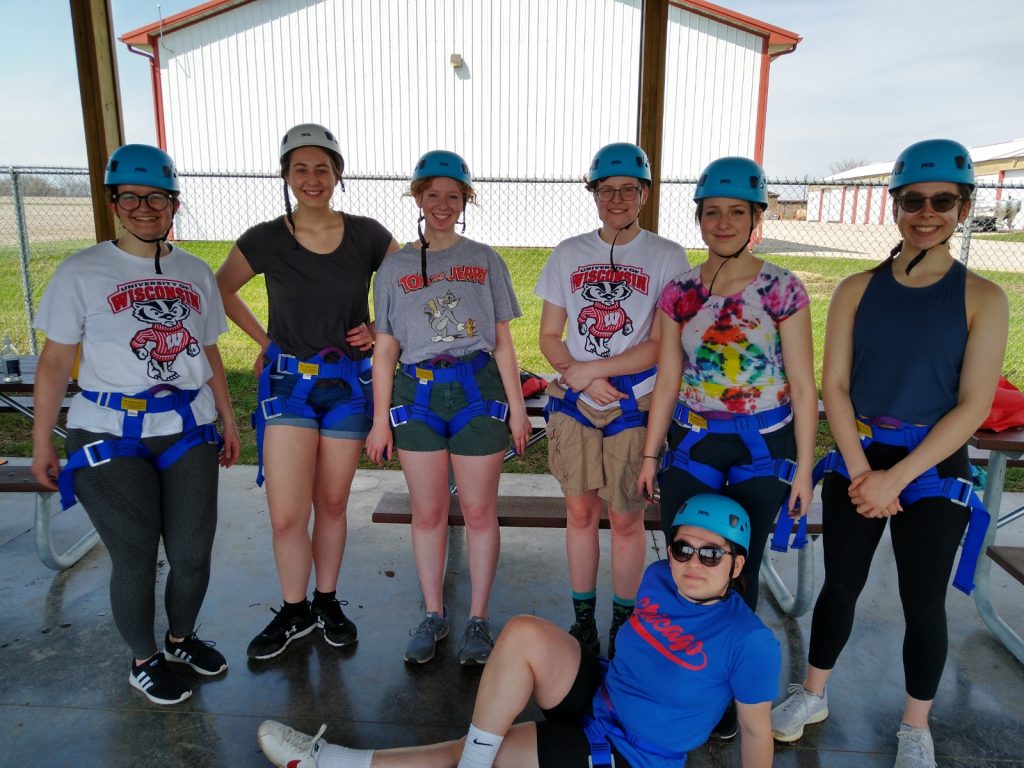 A photo featuring residents of Stockwerk Deutsch in climbing gear and helmets.