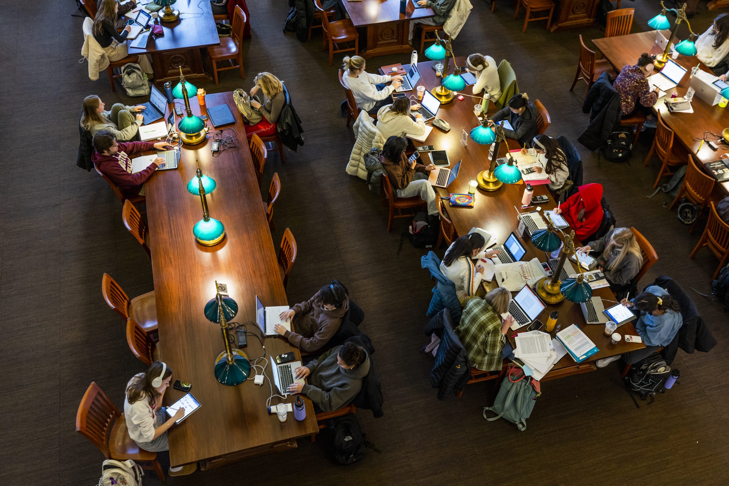 image of students studying in the Library Reading Room at the Wisconsin Historical Society at the University of Wisconsin-Madison on Dec. 9, 2023. (Photo by Taylor Wolfram / UW–Madison)