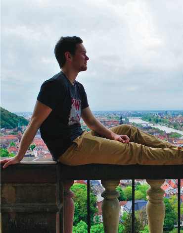 image of study abroad alum Connor  Fuglestad chilling in front of a beautiful view of Bonn