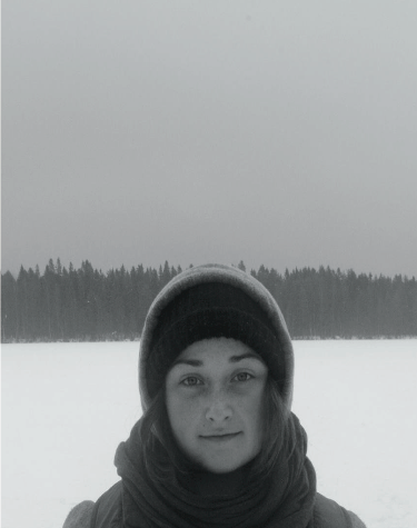 image of study abroad alumna Lucille Williams standing on frozen Lake Nydala on a cold February day.