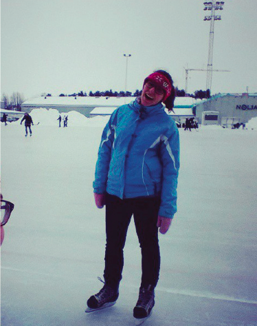 image of study abroad alumna Meghan Radka ice skating in Umeå’s ice arena.