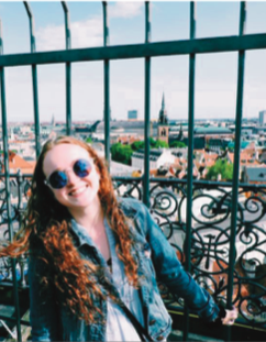 image of study abroad alumna Megan Murphy at the top of the Round Tower, a landmark in Copenhagen.