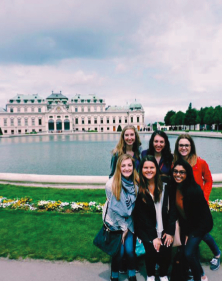 image of study abroad alumna, Lauren Stippich, back left, with classmates at Belvedere Palace in Austria.