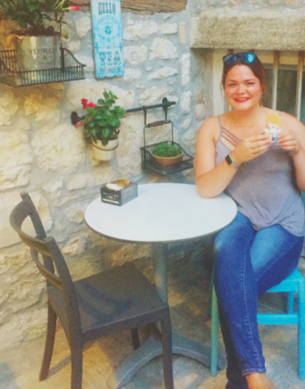 image of study abroad alumna Lexi Argall enjoying a cool treat of gelato.