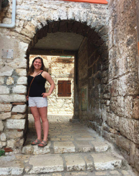 image of study abroad alumna Natalie Rucks exploring the cobblestone streets in Old Town Ravinj.