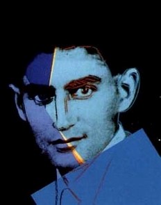 Image is of a young man with various shades of blue on his face.
