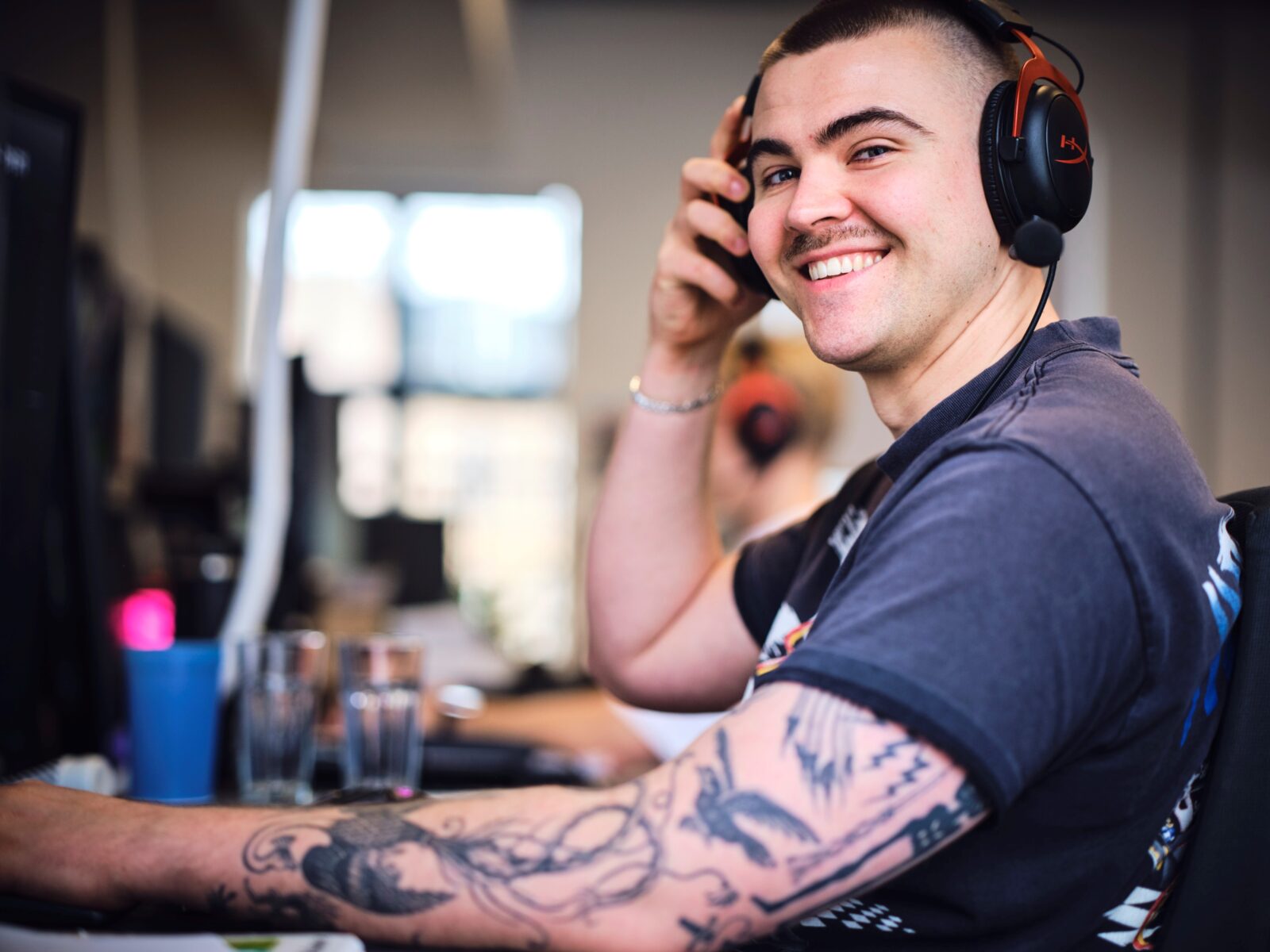 Image of Aaron Hathaway with headphones, looking toward the camera. 
